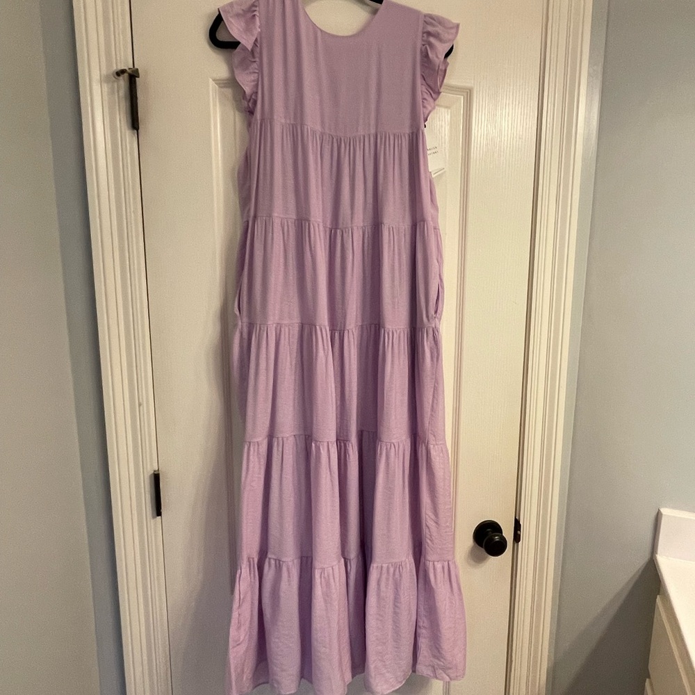 Lavender English factory maxi dress. Has pockets & adjustable tie in back.